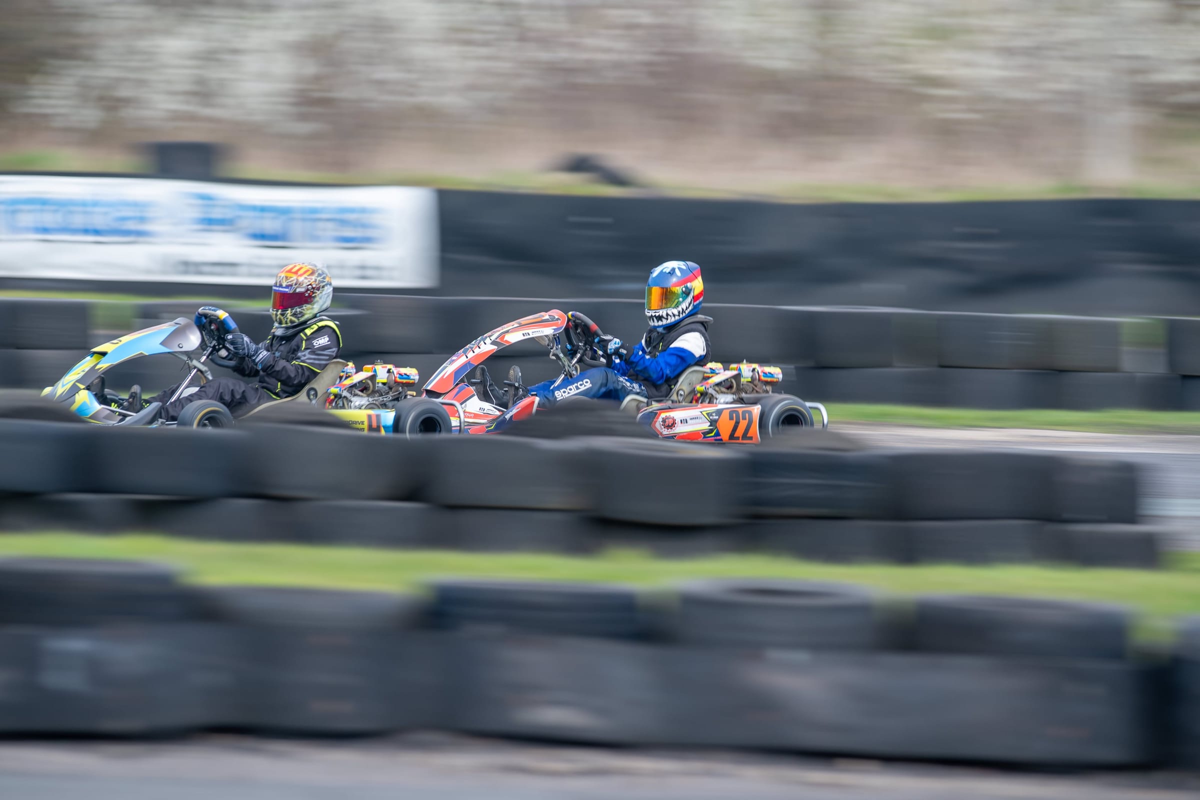 Peter Webster racing wheel to wheel in his kart