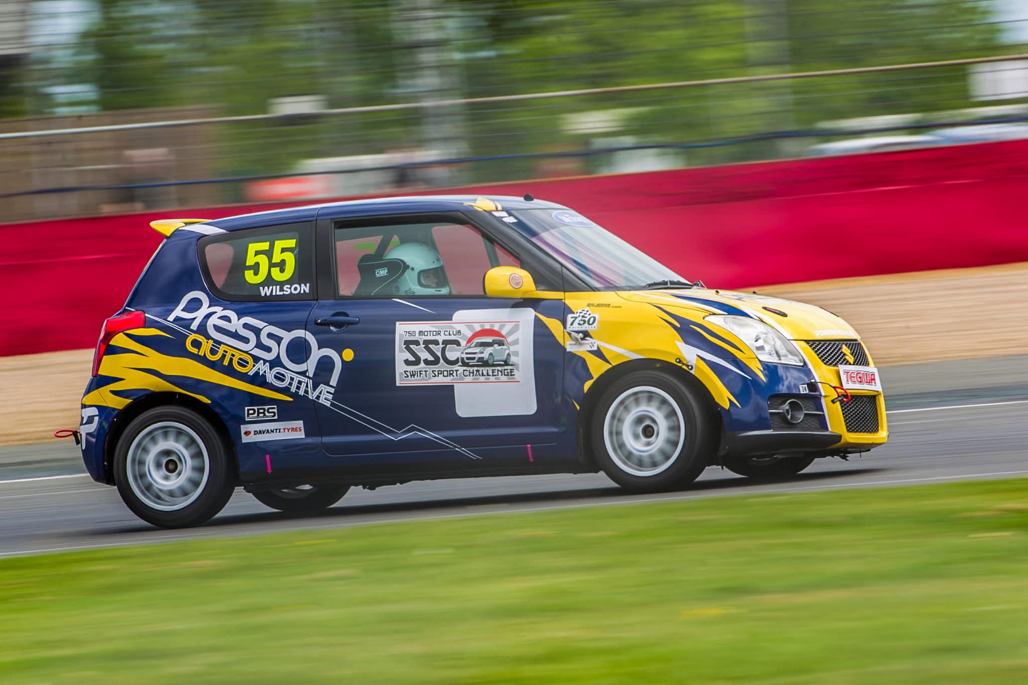 Evelyn Wilson racing her Swift Sport around Silverstone