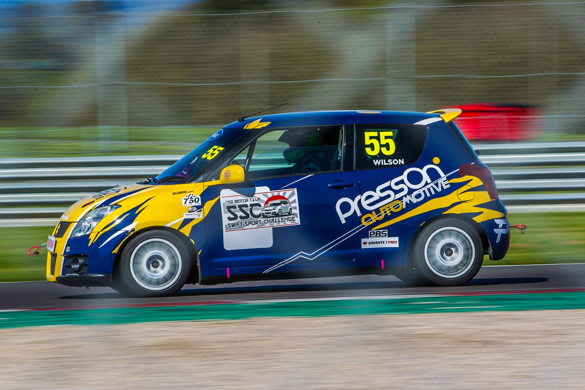 Andy Wilson putting on a show at Donington Park in his Swift Sport