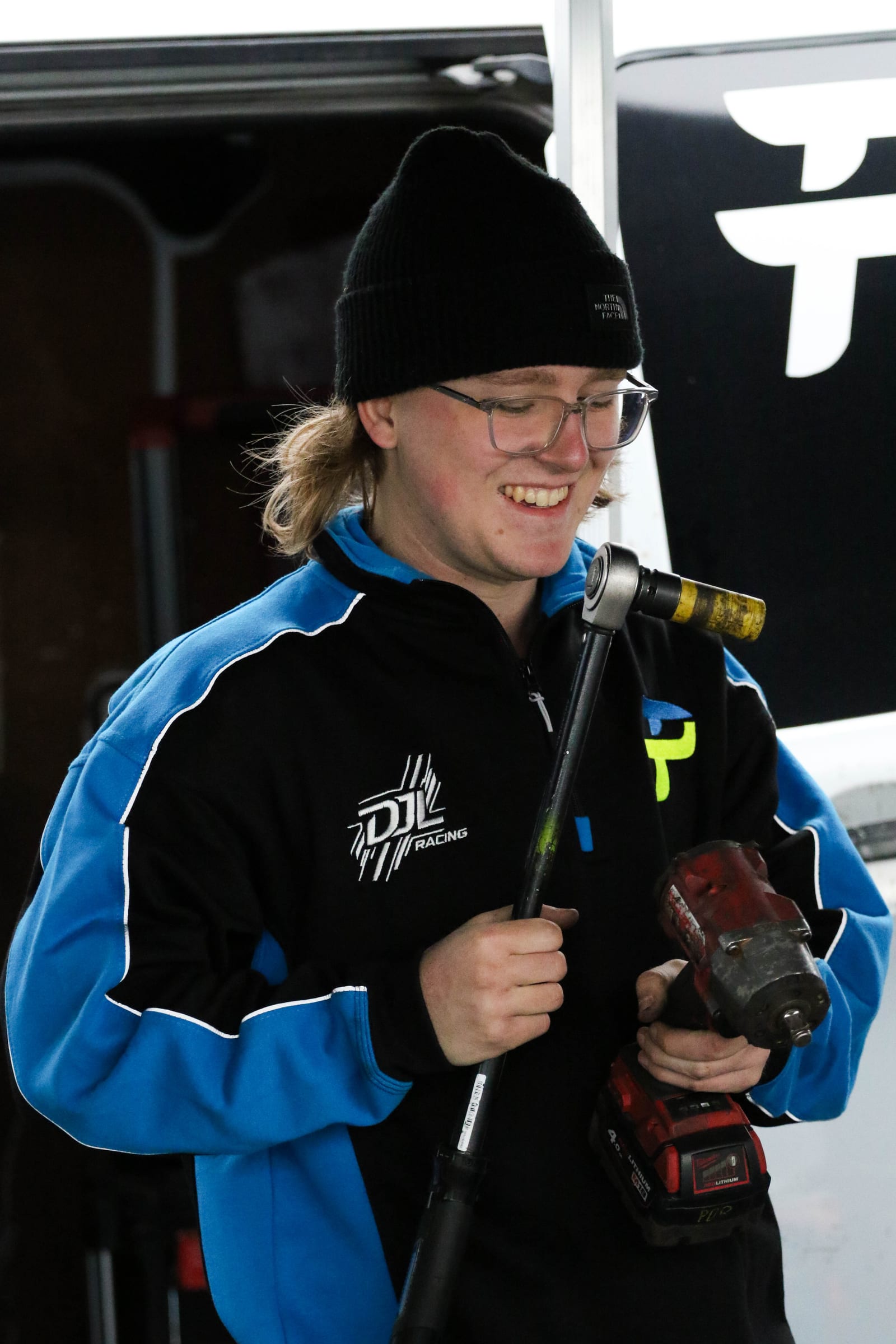 Team member smiling in the paddock